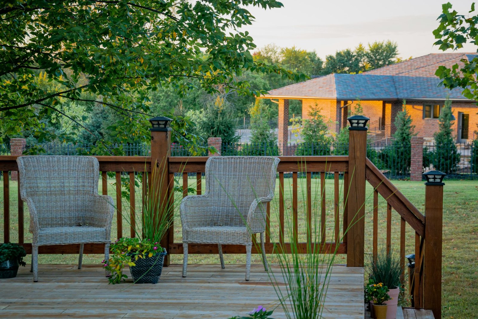 Deck with metal balusters overlooking a lawn